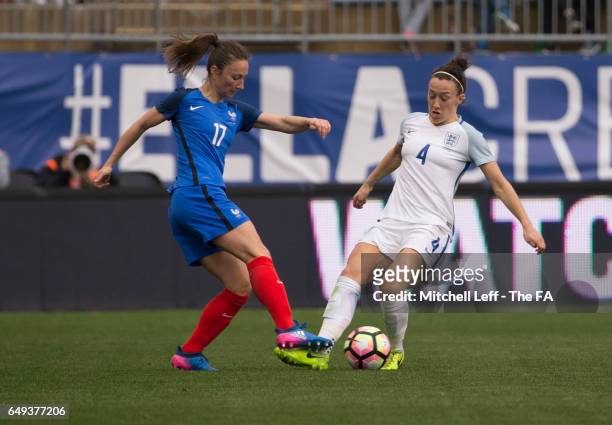 Gaëtane Thiney of France and Lucy Bronze of England fight for the ball during the SheBelieves Cup at Talen Energy Stadium on March 1, 2017 in...