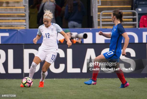 Rachel Day of England controls the ball against Gaëtane Thiney of France during the SheBelieves Cup at Talen Energy Stadium on March 1, 2017 in...