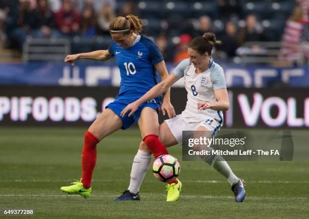 Camille Abily of France and Jade Moore of England fight for the ball during the SheBelieves Cup at Talen Energy Stadium on March 1, 2017 in Chester,...