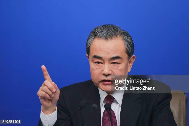 China's foreign minister Wang Yi attends a press conference at Media Center on March 8, 2017 in Beijing, China. In May 2017, Beijing held the Belt...