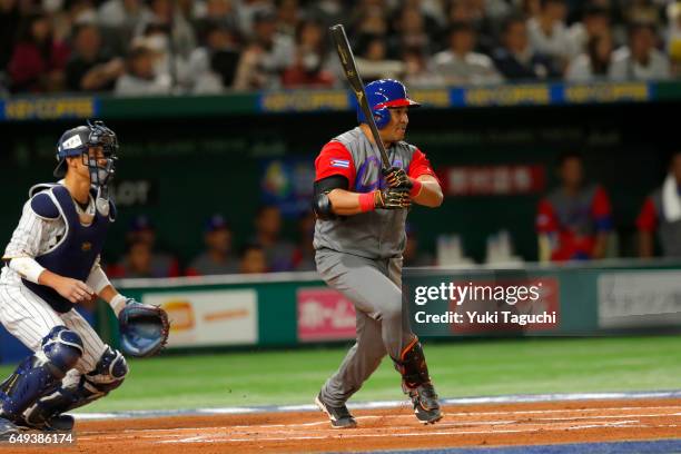 Frederich Cepeda of Team Cuba grounds into a double play in the first inning during the Game 1 of Pool B against Team Japan at the Tokyo Dome on...