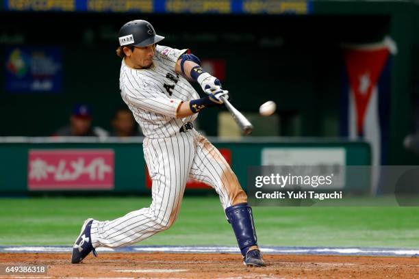 Nobuhiro Matsuda of Team Japan hits a three-run home run in fifth inning during the Game 1 of Pool B against Team Cuba at the Tokyo Dome on Tuesday,...