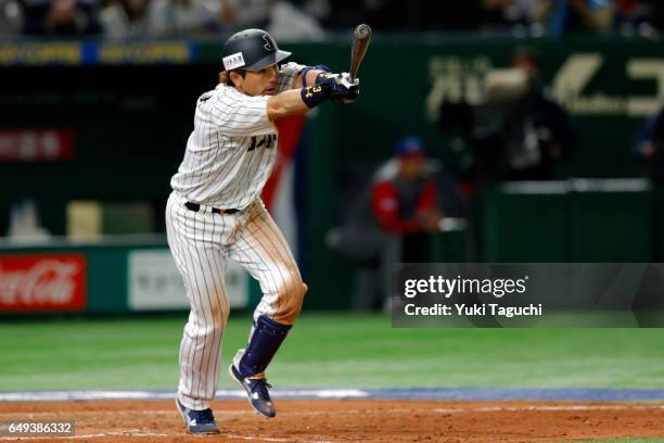 Nobuhiro Matsuda of Team Japan hits a three-run home run in fifth inning during the Game 1 of Pool B against Team Cuba at the Tokyo Dome on Tuesday,...