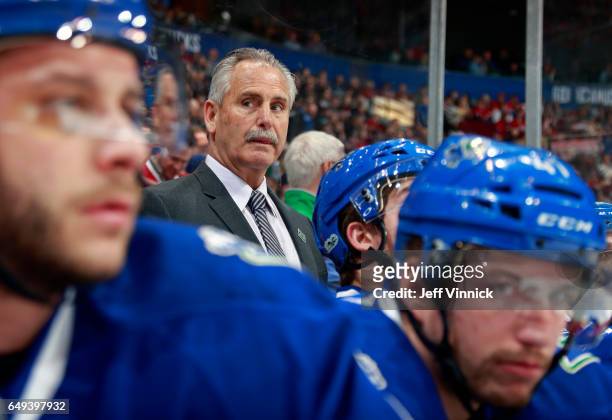 Head coach Willie Desjardins of the Vancouver Canucks looks on from the bench during his NHL game against the Montreal Canadiens at Rogers Arena...