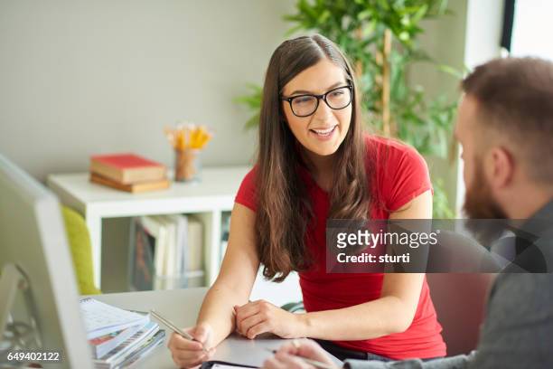work colleagues chatting - university student support stock pictures, royalty-free photos & images
