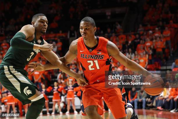 Illinois Fighting Illini guard Malcolm Hill dribbles by Michigan State Spartans guard Alvin Ellis III during the Big Ten conference game on March 1...