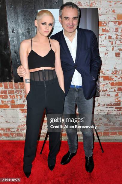 Actress Kristen Stewart and director Olivier Assayas attend the premiere of IFC Films' "Personal Shopper" at The Carondelet House on March 7, 2017 in...