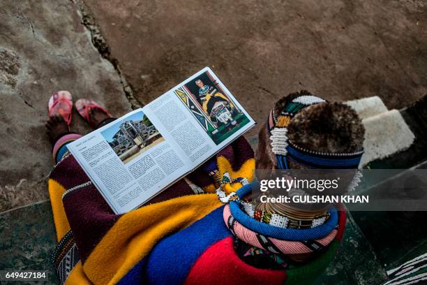 South African artist Esther Mahlangu read a biography of work at her home in Mabhoko Village, Siyabuswa, Mpumalanga on March 6, 2017. Mahlangu...