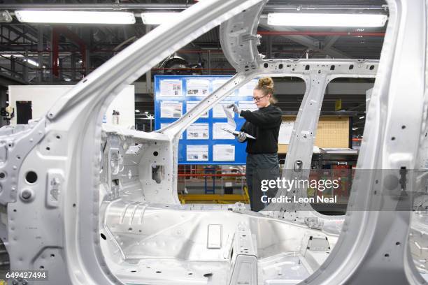 Apprentice Molly Cartwright at the Jaguar Land Rover factory on March 1, 2017 in Solihull, England. The photoshoot was one of a series of portrait...