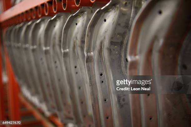 Unfinished doors are seen in storage at the Jaguar Land Rover factory on March 1, 2017 in Solihull, England. The company has pledged it's 'heart and...
