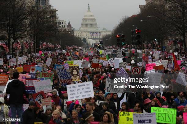 Tens of thousands march to the White House down Pennsylvania Avenue during the Women's March on Washington, January 21, 2017.