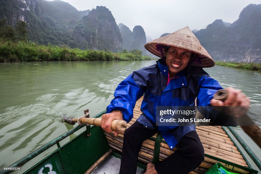 Boatman at Trang An Complex - Trang An Landscape Complex is...