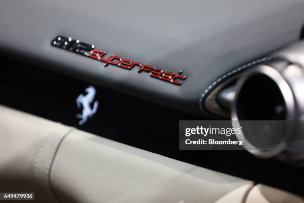 Decal sits on the rear of a Ferrari NV 812 Superfast luxury automobile as it stands on display on the second day of the 87th Geneva International...