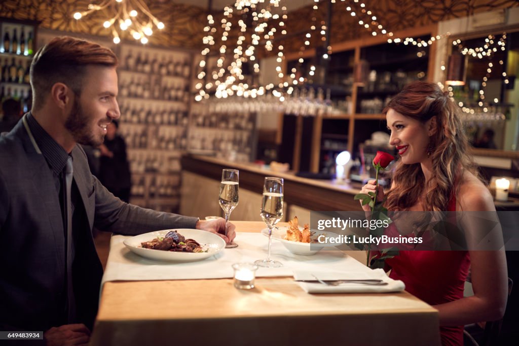 Romantic couple have dinner in restaurant