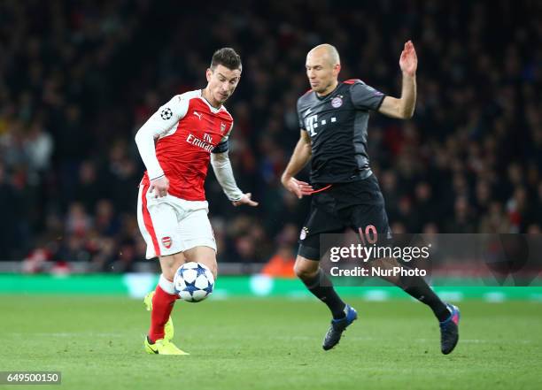 Arsenal's Laurent Koscielny and Arjen Robben of FC Bayern Munich during UEFA Champions League - Round 16 - 2nd Leg match between Arsenal and Bayern...