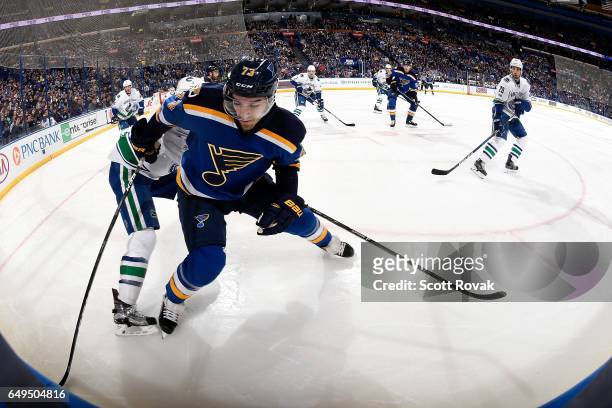 Kenny Agostino of the St. Louis Blues handles the puck against the Vancouver Canucks on February 16, 2017 in St. Louis, Missouri.