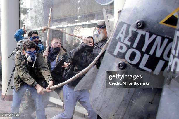 Farmers with shepherds crooks clash with riot policemen during a protest outside the Greek Agriculture Ministry on March 8, 2017 in Athens, Greece....