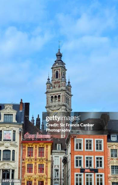 lilly cityscape with chamber of commerce building belfry rising behind old colorful houses, france - lille_france photos et images de collection