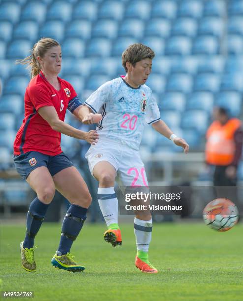 Maren Mjelde of Norway and Kumi Yokoyama of Japan during the Group B 2017 Algarve Cup match between Norway and Japan at the Estadio Algarve on March...