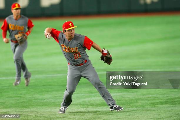 Ray Chang throws to first base in second inning during Game 2 of Pool B between Team China and Team Cuba at the Tokyo Dome on Wednesday, March 8,...