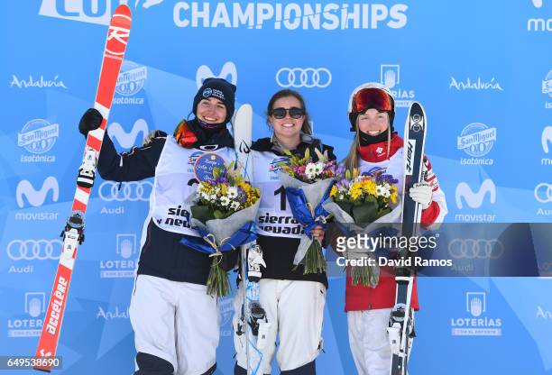 Sliver medalist Perrine Laffont of France, gold medalist Britteny Cox of Australia and bronze medalist Justine Dufour-Lapointe of Canada pose during...