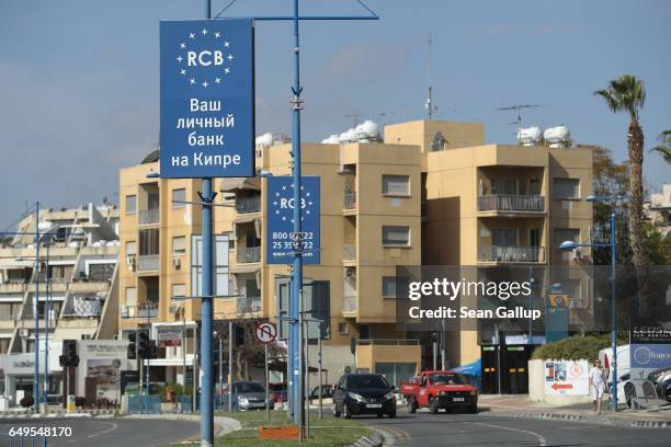 Sign in Russian advertises for Russian-owned RCB bank on March 8, 2017 in Limassol, Cyprus. Cyprus has largely recovered from its 2012-2013 economic...