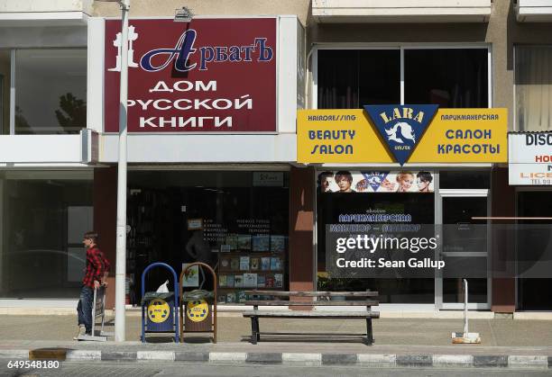 Russian bookstore and a Russian beauty salon stand on March 8, 2017 in Limassol, Cyprus. Cyprus has largely recovered from its 2012-2013 economic...