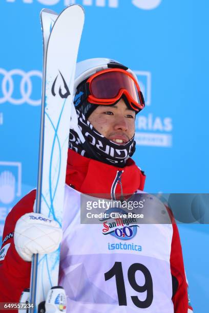 Gold medalist Ikuma Horishima of Japan poses during the flower ceremony for the Men's Moguls on day one of the FIS Freestyle Ski & Snowboard World...