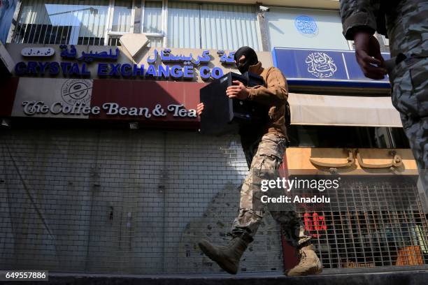 Lebanese security forces carry out an anti-terror operation against certain exchange offices and money transfer companies, which were allegedly...