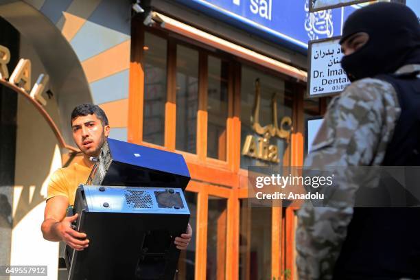 Lebanese security forces carry out an anti-terror operation against certain exchange offices and money transfer companies, which were allegedly...