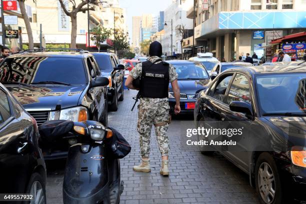 Lebanese security forces carry out an anti-terror operation against certain exchange offices and money transfer companies, which were allegedly...