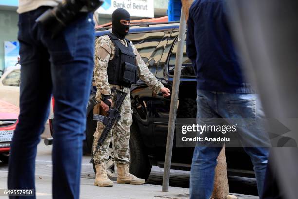 Lebanese security forces carry out an anti-terror operation against certain exchange offices and money transfer companies, which were allegedly...