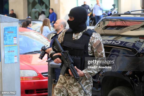 Lebanese security forces carry out an anti-terror operation against certain exchange offices and money transfer companies, which were allegedly...