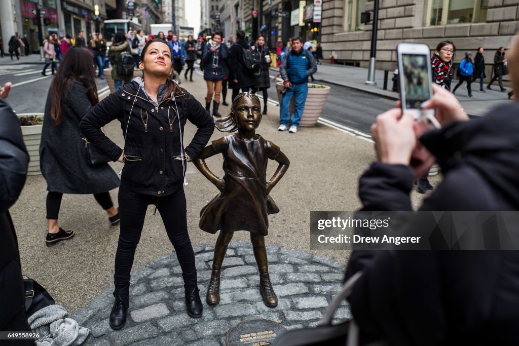 Statue Of Defiant Girl Installed In Front Of Iconic Wall Street Bull By Global Investment Firm