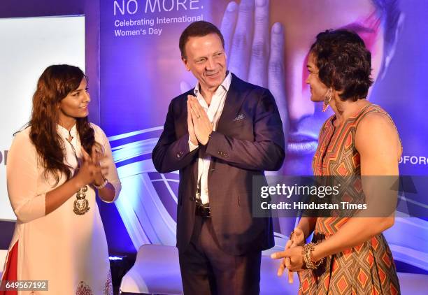 Paolo Colella, India Head Ericsson greets to Phogat Sisters Geeta and Babita on the occasion International Women's Day at a function in Ericsson...