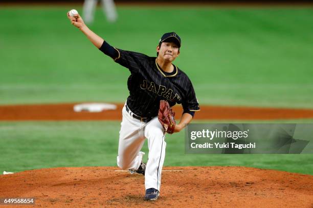 Tomoyuki Sugano of Team Japan pitches in the second inning during Game 3 of Pool B against Team Australia at the Tokyo Dome on Wednesday, March 8,...