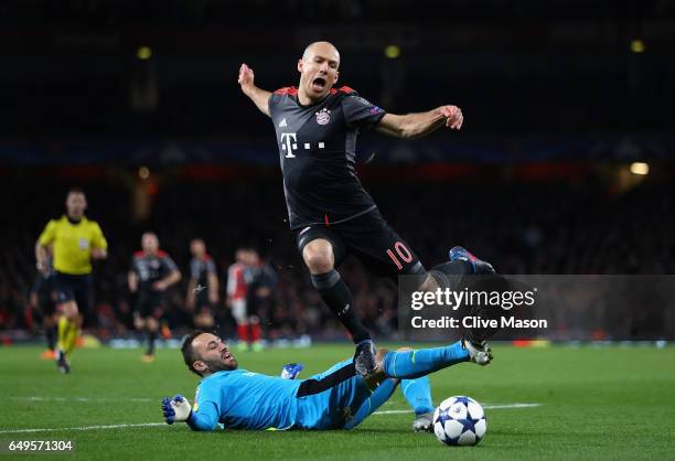 Arjen Robben of Bayern Muenchen evades goalkeeper David Ospina of Arsenal during the UEFA Champions League Round of 16 second leg match between...