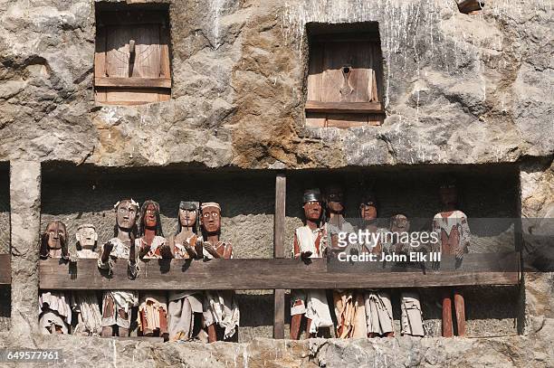 torajan cliff burial effigy figures (tau tau) - celebes stock pictures, royalty-free photos & images