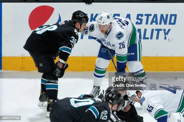 Micheal Haley of the San Jose Sharks and Joseph Cramarossa of the Vancouver Canucks stare each other down just prior to a scuffle at SAP Center at...
