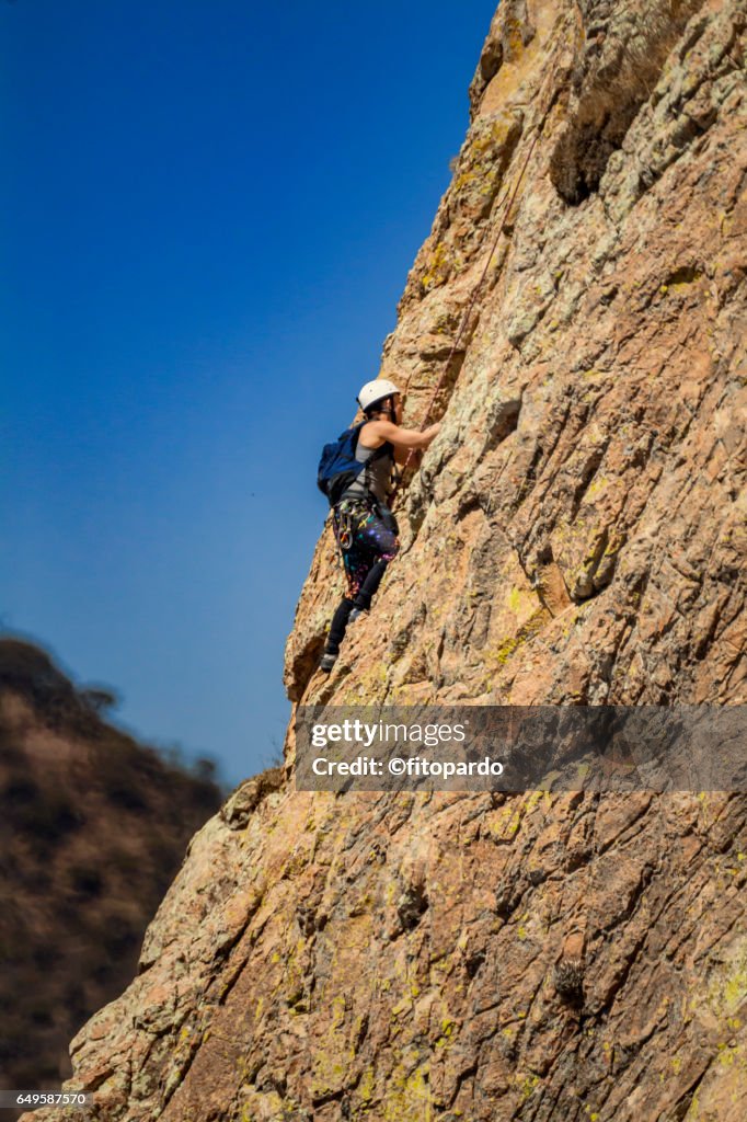 Rock climbers at Peña de Bernal