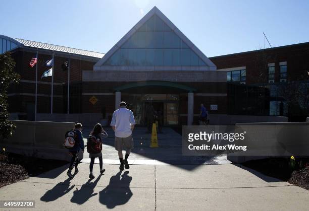 Parent arrives at Mount Vernon Recreation Center to drop off his children for temporary day care that is offered by the city government in response...
