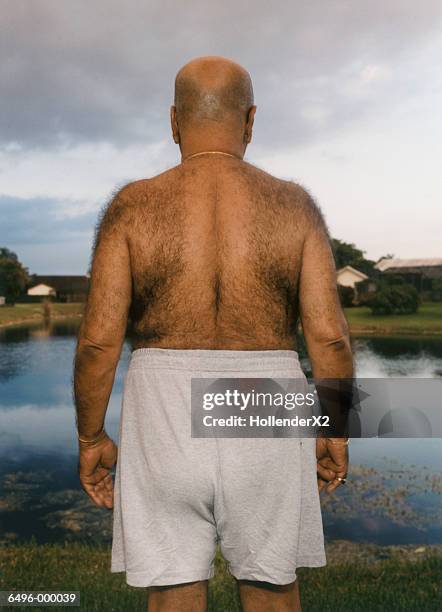 man with hairy back - hairy back stock pictures, royalty-free photos & images