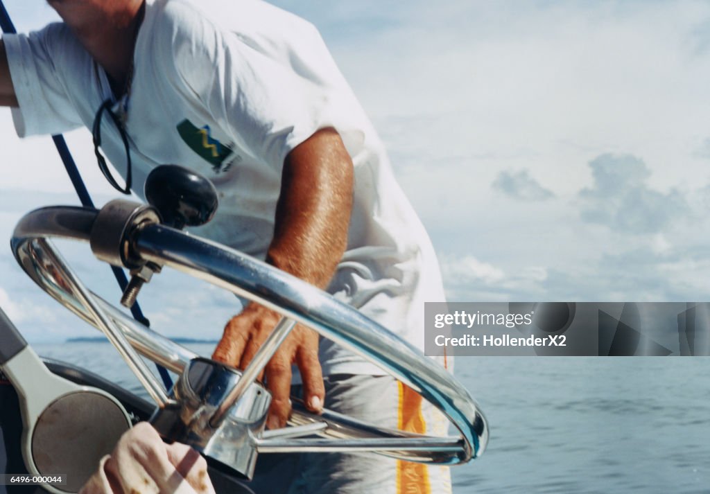 Man at Helm of Boat