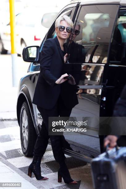 Lara Bingle, Sam Worthington and their son Rocket leave Sydney on December 1, 2015 in Sydney, Australia.