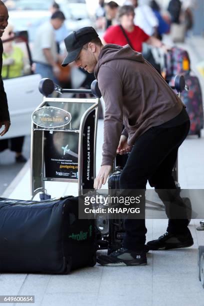 Lara Bingle, Sam Worthington and their son Rocket leave Sydney on December 1, 2015 in Sydney, Australia.