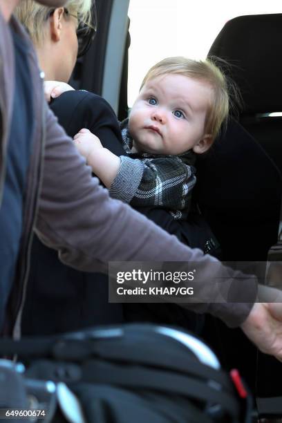 Lara Bingle, Sam Worthington and their son Rocket leave Sydney on December 1, 2015 in Sydney, Australia.