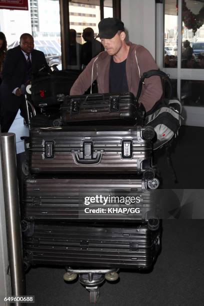 Lara Bingle, Sam Worthington and their son Rocket leave Sydney on December 1, 2015 in Sydney, Australia.