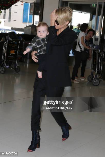 Lara Bingle, Sam Worthington and their son Rocket leave Sydney on December 1, 2015 in Sydney, Australia.