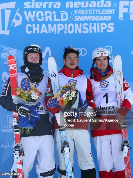 Ikuma Horishima of Japan wins the gold medal, Benjamin Cavet of France wins the silver medal, Mikael Kingsbury of Canada wins the bronze medal during...