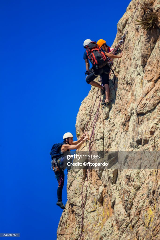 Rock climbers at Peña de Bernal